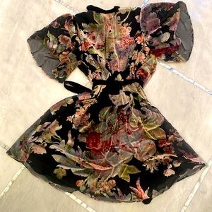 Stunning floral print dress with black velvet belt and neck tie.